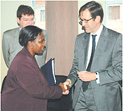 Museminari, shakes hands with EU Heads of Mission accredited to Rwanda.