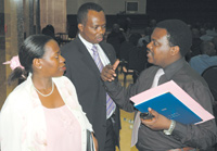 L-R: Nsanzabaganwa and State Minister for Industry and Investment Promotion, Vincent Karega, listen to the Mayor of Nyarugenge District, Origu00e8ne Rutayisire, after the meeting at Prime Holdings Conference Centre in Kimihurura. (Photo/G. Barya)