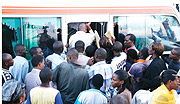 Itu2019s every man for himself: People fighting to board a taxi at kwarubagura in Kigali city. (Photo / E. Mucunguzi).