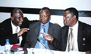 MEN AT THE HELM:  Leodgar Chilla Tenga (L), his predecessor Denis Obua (C) and Cecafa SG Nicholas Musonye share a light moment.