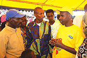 One of the MTN Rwanda staff sensitizing a group of refugees in Gihembe refugee camp in Gicumbi district..