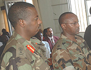 Brig Gen. Wilson Gumisiriza (L), Maj. Wilson Ukwishaka and Lawyers before court in Nyamirambo Yesterday. (Photo/ J. Mbanda)