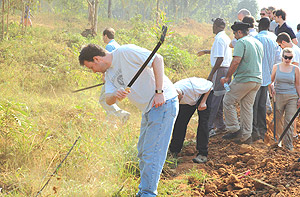 Conservatives cleared long grass in Kicukiro as part of Umuganda. (Photo/G.Barya).