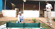 Andrew Mitchell MP builds school furniture during last yearu2019s Project Umubano. (Courtesy photo).