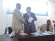 Fifa Technical Director Jean Michel Benezet handing over part of the equipment to Ferwafa boss Brig. Gen. John Bosco Kazura (Photo/ B. Mugabe)