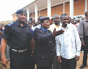 Acting Commissioner General of Police, Mary Gahonzire(C) explains to a youth leader as Director of Community Policing, Chief Supritendent Emmanuel Butera looks on. (Photo/ J.Mbanda)