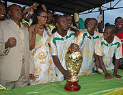 NEW CHAMPS: Atraco players and club vice president Frank Nsengiyumva (left) show their emotions after being crowned 2008-09 league champions yesterday. (Photo /G. Barya)