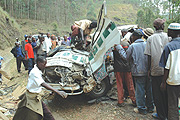 Volunteers had to cut through the wreckage to remove the mangled bodies from a taxi that overturned yesterday along Musanze-Kigali road. ( Photo/ J. Mbanda)