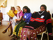 Rwanda Knits members with trainer Laura Hanison (second left) show off their products