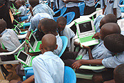 Students of Kagugu Primary School receiving laptop computers last friday. (Photo / J. Mbanda).