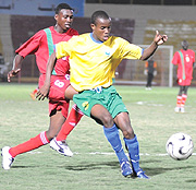 Rwandau2019s U-17 defender Annual Kibaya beats a Sudanese striker to the ball in the first leg in   Khartoum.