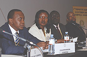 Uhuru Muigai Kenyatta (L), Kenyau2019s Deputy Prime Minister , Monique Mukaruliza, Rwandau2019s Minister of East African Affairs attending the preliminary meetings of ministers and technocrats in Kampala, Uganda. (Photo/B.Namata)