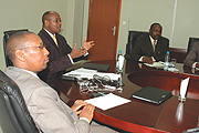 Finance Minister, James Musoni (C) stresses point while his Permanent Secretary, John Rwangombwa (L) and Central Bank Governor, Francois Kanimba listen. (Photo/G. Barya)