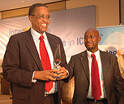 Rwakabamba (L with award) and Bakuramutsa at the Intego Awards ceremony, Serena Hotel. (Photo/G.Barya)