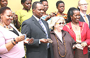 Gahaya proprietor Janet  Nkubana (L) Minister of state in charge of water and Mine Vicent Karwega, UNAIDS Mary Fisher, Minister of Health permanent secretary dr. Agnes Binagwaho admires Gahaya links products. (File photo).