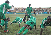 HISTORY: Kiyovu players led by Jean Baptist Mugiraneza (left, on the ground) and Djabil Mutarambira (C) celebrate the equalizer against APR last season. Ironically, the pair are now on APR books, and for them, itu2019s APR first and Kiyovu second when the two