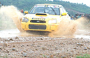 NEW CHAMPION: Giancarlo cruises his Subaru on a flooded road (Photo/ G.Barya)