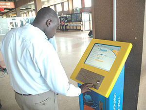 A man surfs the internet at the newly installed Kiosk at Kigali International Airport. (Photo/ J Mbanda).