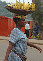 A woman vending bananas in Kigali such need capacity building.