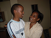 Eric Manzi Rugamba being conglatulated by his mother Ansilla Akayezu after the news broke that he had emerged as the countryu2019s best in Ou2019Level exams. (Photo /R Mugabe)