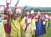 Pupils excitedly show off their new books. (File photo)