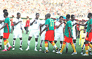 HI-FIVE: Ghana and Cameroon players enjoy a hi-five before their group stage game that ended 1-1. But when the two sides meet in the final this afternoon, there surely must be a winner. Ghana beat Cameroon in the 1993 final. (Photo / G. Barya)