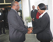 The Speaker of the Burkina Faso National Assembly, Roch Marc Christian Kabore, bids farewell to his Rwandan counterpart, Rose Mukantabana.