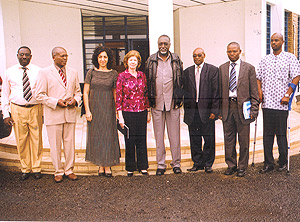 Ombundsman Tito Rutaremara (4th R) is flanked by Transparency International President Labelle Huguette (L) and Transparency Rwanda Executive Secretary Paul Kananura in a group photo.