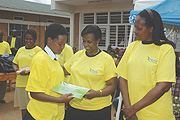 Foreign Affairs Minister Rosemary Museminali (C) and Kigali City Mayor Aisa Kirabo reward best performing  girl students yesterday. (Photo/ J. Mbanda)