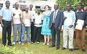 Head of Mission SIDA, Richard Bomboma (3rd  R)  and  Director of Gisozi  Kigali Memorial Centre, Freddy Mutanguha (extreme Left) pose for group photo yesterday.(Photo/ G. Barya)