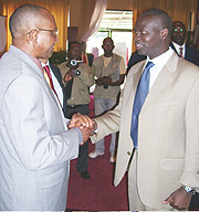 Minister Stanislas Kamanzi (R) shares a light moment with DRC First Deputy Premier Emile Bongeli at the meeting in Kinshasa yesterday. (Photo/ E. Musoni)