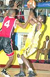 APRu2019s new signing Gerol Ndugu (R) battles for possession with Ugandau2019s Norman Blick during the Zone Five championship held in Kigali in April. (File photo)