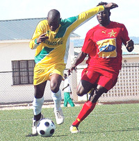 Atraco striker Hamisi Kiteganda battles with an El Merrikh opponent when the two sides met in the Champions League early this year in Kigali.