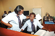 Some of Kicukiro District employees clad in their new trademark uniforms at work. (Photo J Mbanda)