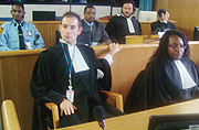 Former Director of Cabinet  in the Rwandan Interior Ministry, Callixte Kalimanzira seated in the back row (middle) with his defence counsels.