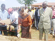 The Mayor of Gasabo district,Claudine Nyinawagaga, launches the construction of  60 houses, as President of Red Cross Rwanda Dr.Bernard Nzigiye looks on.