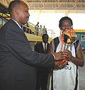 APRu2019s Gaylord Ndugu receives the Gisembe trophy. (Photo /J. Mbanda)