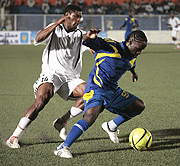 TP Mazembeu2019s Bagnack Leopold challenges KCCu2019s Robert Ssentago (right). KCC 3-2 TP Mazembe, Benadir 2-2 Prisons on Wednesday. (Photo/ Cecafa)