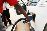 A pump attendant refill a vehicle at one of the gas stations in Kigali (File Photo).