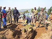 RDF 408 Brigade soldiers and Rulindo residents participate in the demarcation of plots for construction of houses for the needy. (Photo: A. Gahene)