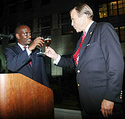 Health Minister Richard Sezibera  and US Ambassador to Rwanda Stuart  Symington make a toast to mark the American independence on Thursday (Photo J Mbanda).