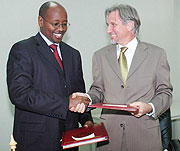 Finance Minister James Musoni and Netherlands Ambassador to Rwanda Frans Makken shake hands after signing the MOU. (Photo J Mbanda)