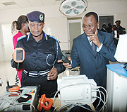 Acting Commissioner of Police, Mary Gahonzire and the UN Resident Coordinator, Aurelien Agbu00e9nonci, ispecting some of the equipment at the centre.