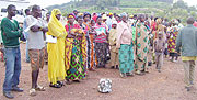 Returnees line up for screening at Gicumbi transit camp. (Photo: A.Gahene)