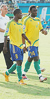 Amavubi Stars coach Branko Tucak walks onto the field with his players during the 2010 World/ CAN qualifier against Algeria. (File photo)