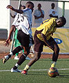 APRu2019s Patrick Mafisango (L)  tries to tackle Mukurau2019s striker. Mafisango had a tough time in the middle of the pack and will have to up his game in the return leg. 