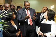 (L-R)  Minister of Trade and Commerce u2013 Monique Nsanzabaganwa listens as Patrick Kagabo u2013 CEO of MAXINET explains a point to IFCu2019s Dorothy Berry and Jean Philippe Prosper. (courtesy photo)