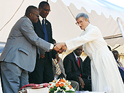 Ministers Joseph Habineza  and Protais Mitali congratulate Father Mario Falconi ( Photo by H. Fidele Goodman)