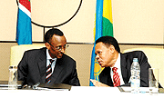 President Kagame and Ambassador Mwapachu, EAC Secretary General share a light moment during the EAC retreat recently (FIle Photo)