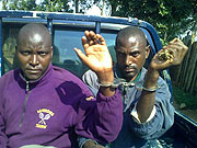 4-1 Murder suspects Celestin Nsengumuremyi (husband to deceased, Right) and his nephew Joseph Iryamukuru being taken to police (Photo S Mugisha)